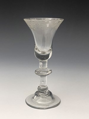 Lot 581 - A balustroid wine glass, circa 1735, the bell...