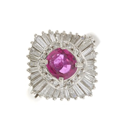 Lot 169 - A platinum ruby and diamond cluster dress ring