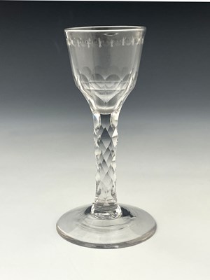 Lot 583 - A facet cut wine glass, circa 1770, the ogee...