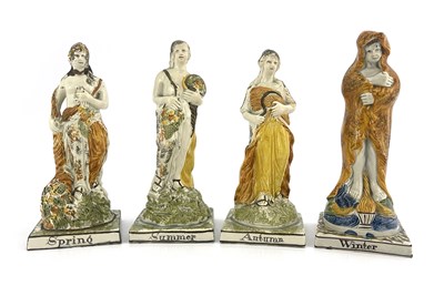 Lot 844 - A set of four Prattware allegorical figure of...