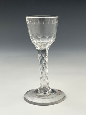 Lot 586 - A facet cut wine glass, circa 1770, the ogee...