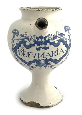 Lot 834 - An English Delft blue and white medicine...