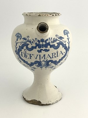 Lot 834 - An English Delft blue and white medicine...