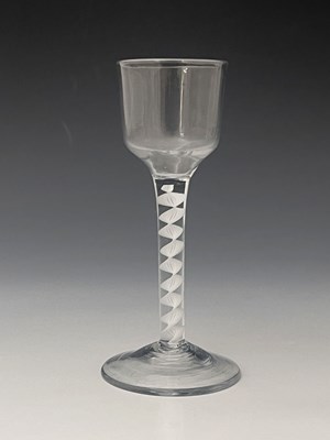 Lot 588 - An opaque twist wine glass, circa 1770, the...