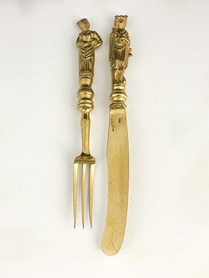 Lot 34 - A cased Victorian gilt metal knife and fork...