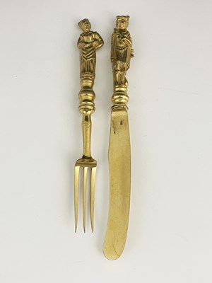 Lot 34 - A cased Victorian gilt metal knife and fork...