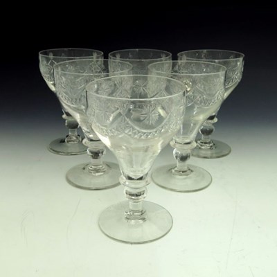 Lot 596 - A set of six George III cut glass rummers,...