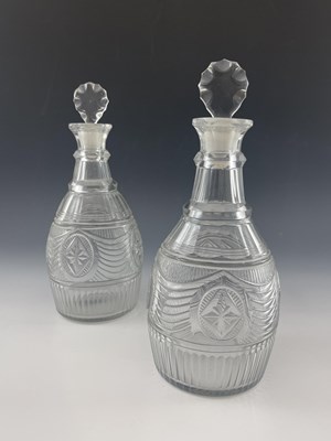 Lot 600 - A pair of Anglo Irish cut glass decanters,...