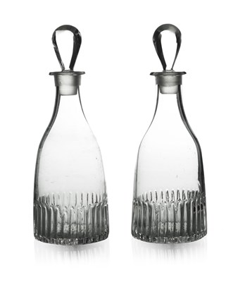 Lot 604 - A pair of Anglo Irish glass spirit decanters,...