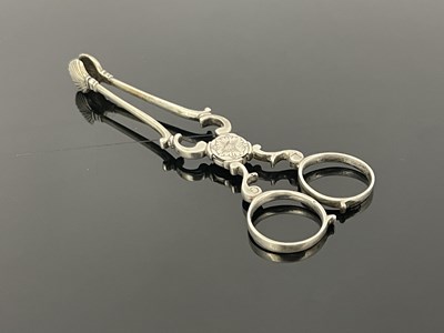 Lot 92 - A pair of Eighteenth-century silver tea tongs,...