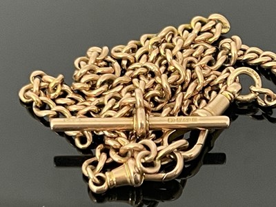 Lot 10 - A 9 carat gold watch chain, fob links and T...