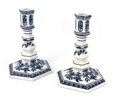 Lot 636 - A pair of Meissen Onion pattern candlesticks,...