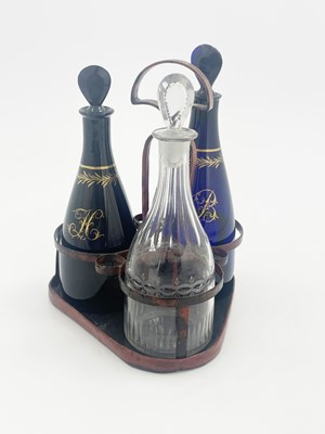 Lot 489 - Three George III glass spirit decanters