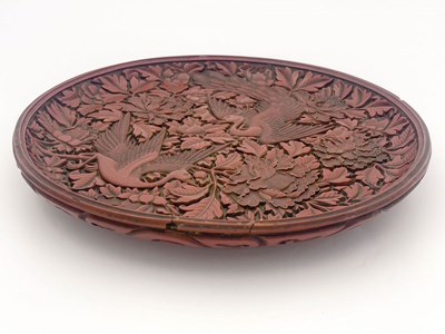 Lot 15 - A Cinnabar carved lacquer circular charger,...