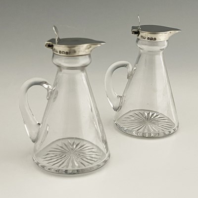 Lot 418 - A pair of George V silver mounted glass whisky...