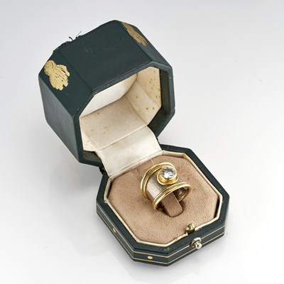Lot 111 - Elizabeth Gage, an 18ct gold diamond single-stone band ring