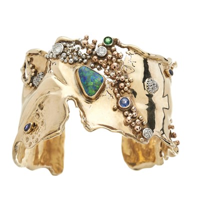 Lot 110 - A modernist 9ct gold black opal, diamond and gem-set cuff bangle