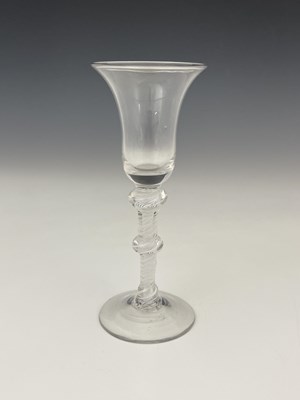 Lot 445 - A triple knopped opaque twist wine glass,...