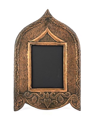 Lot 128 - An Arts and Crafts copper photo frame, Persian...