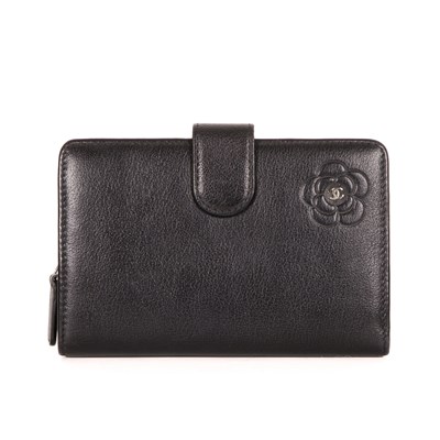 Lot 310 - Chanel, a Camillia wallet, crafted from black...