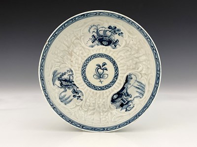 Lot 1003 - A Liverpool porcelain relief moulded blue and...