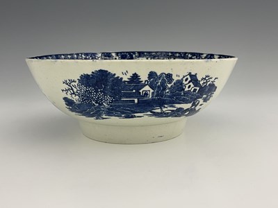 Lot 1027 - A Liverpool porcelain blue and white punchbowl,...