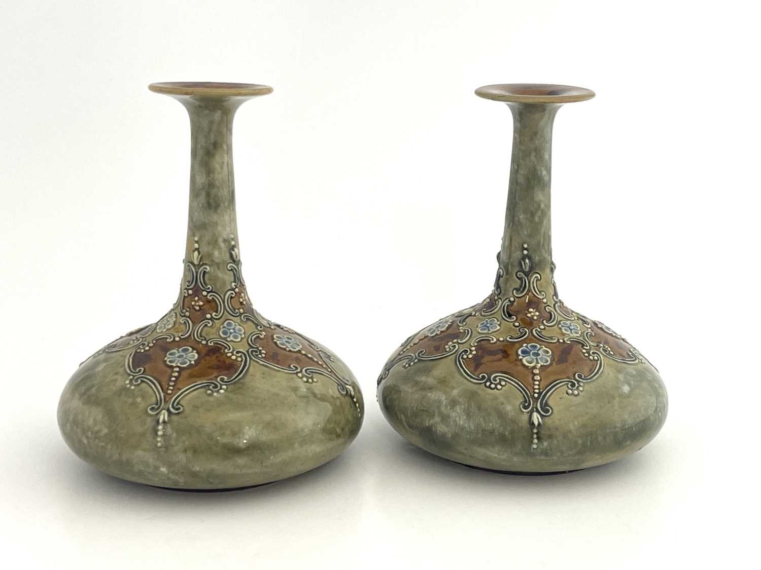 Lot 702 - A pair of Royal Doulton stoneware vases, onion...
