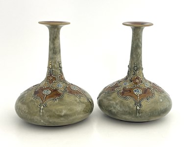 Lot 702 - A pair of Royal Doulton stoneware vases, onion...