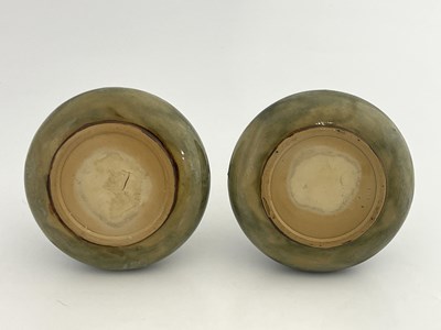 Lot 702 - A pair of Royal Doulton stoneware vases, onion...