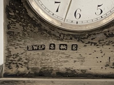 Lot 59 - An Edwardian silver desk clock and a novelty...