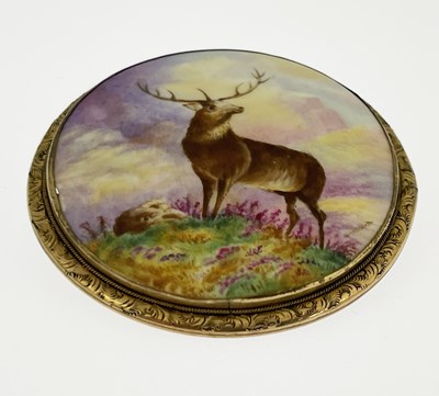 Lot 12 - A gold mounted porcelain plaque brooch,...