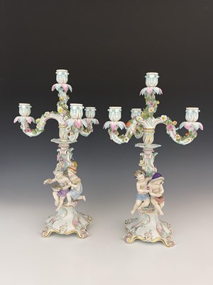 Lot 656 - A pair of Meissen three branch/four sconce...