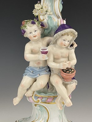 Lot 656 - A pair of Meissen three branch/four sconce...