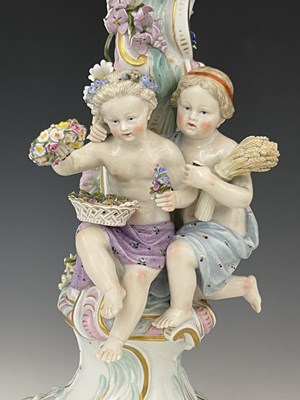 Lot 656 - A pair of Meissen three branch/four sconce...