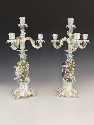 Lot 656 - A pair of Meissen three branch/four sconce...