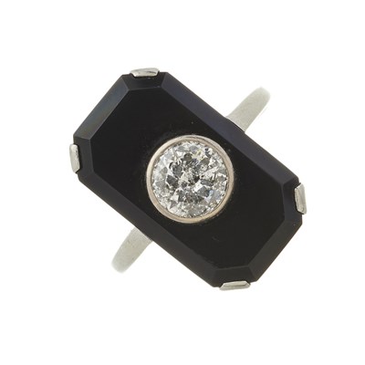 Lot 71 - A mid 20th century platinum, diamond and onyx dress ring