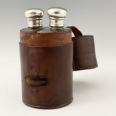 Lot 426 - An Edwardian travelling leather cased flask...