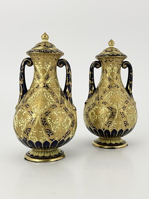 Lot 828 - A pair of Royal Crown Derby twin handled vases...