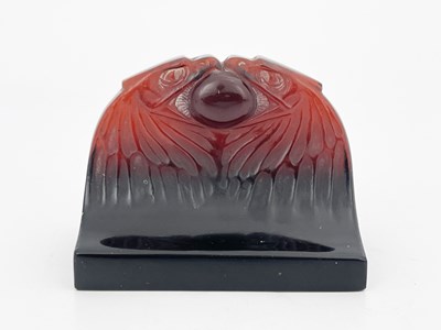 Lot 424 - Rene Lalique, a Deux Aigles red amber glass...