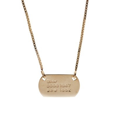 Lot 336 - Christian Dior, a New Look 1947 dog tag...