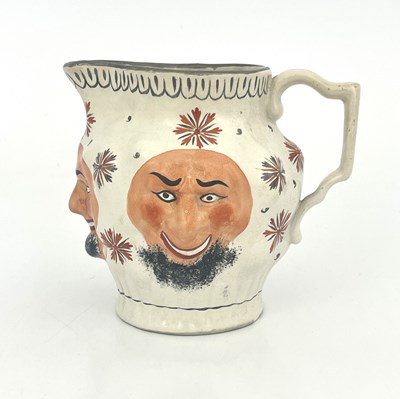 Lot 1016 - A relief moulded Pratt type shaving jug, circa...