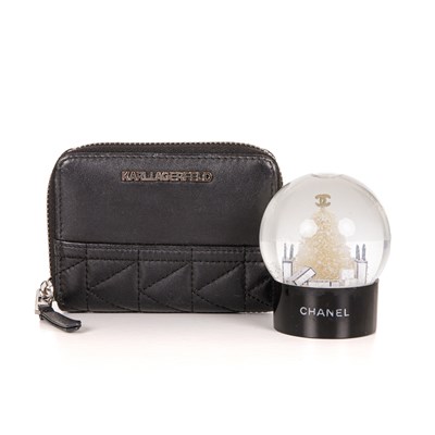 Lot 311 - Chanel, a small snow globe and a Karl...