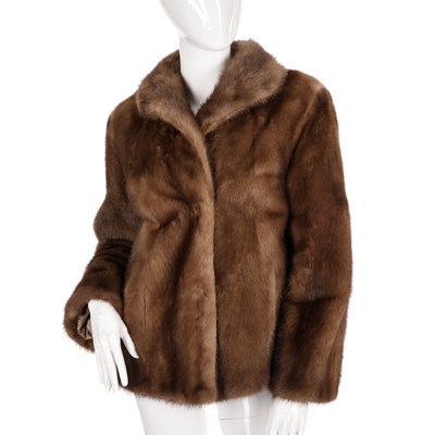 Lot 484 - A demi-buff mink jacket, featuring a lapel...