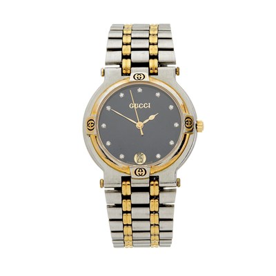 Lot 360 - Gucci, a stainless steel and gold plated 9000M...