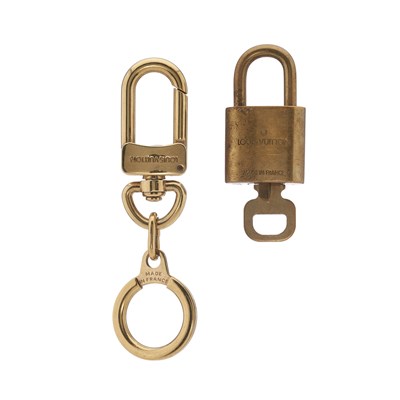 Lot 399 - Louis Vuitton, a gold-tone bolt key holder and...