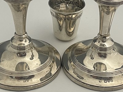 Lot 13 - A pair of George V silver candlesticks, each...