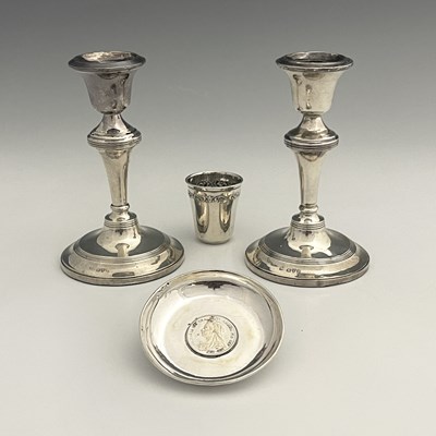 Lot 13 - A pair of George V silver candlesticks, each...