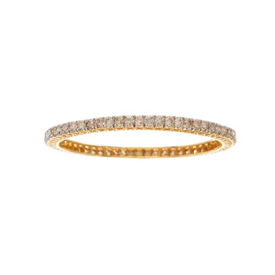 Lot 32 - A 14ct gold brilliant-cut diamond line bangle...