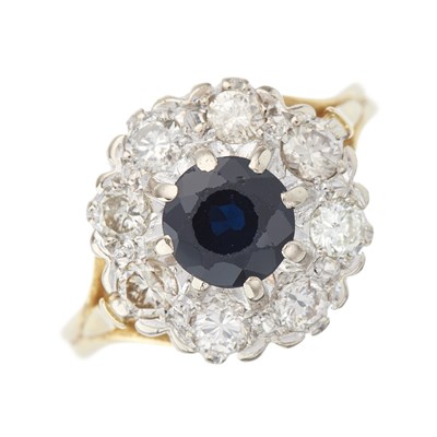 Lot 61 - An 18ct gold sapphire and brilliant-cut...