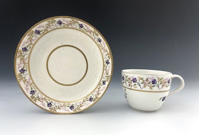 Lot 823 - A Pinxton porcelain tea cup and saucer,...